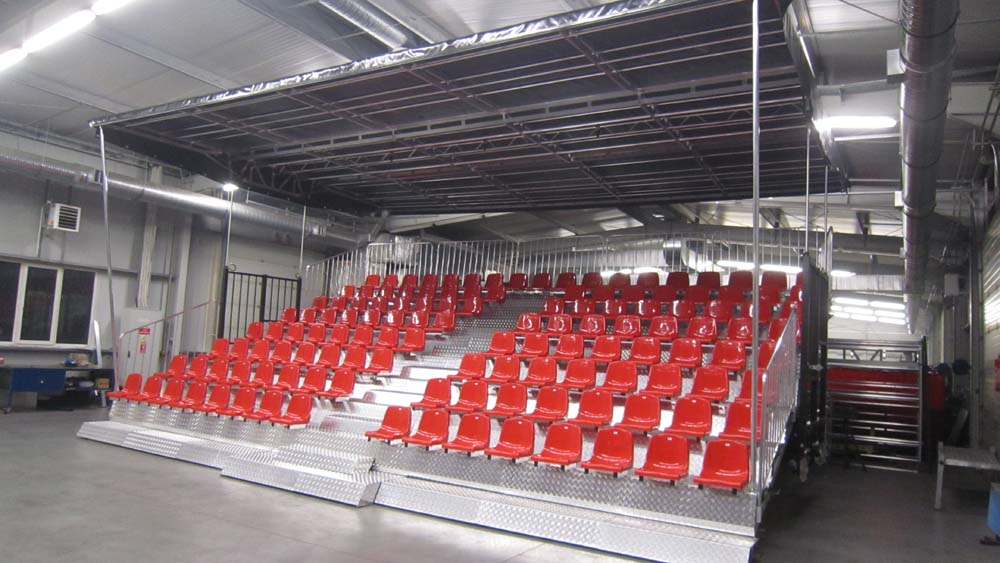 KL Seating GS171 temporary tiered seating — 171 covered seats with red seats, opened out in the depot workshop